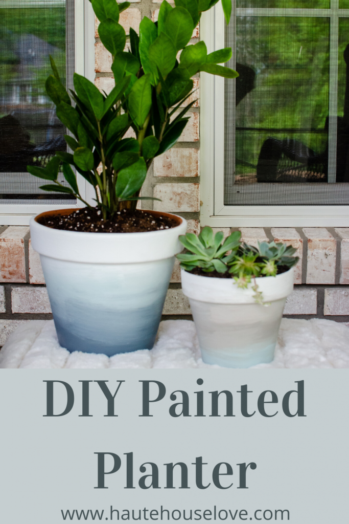 This is an ombre painted terra cotta flower pot using white and blue paint.