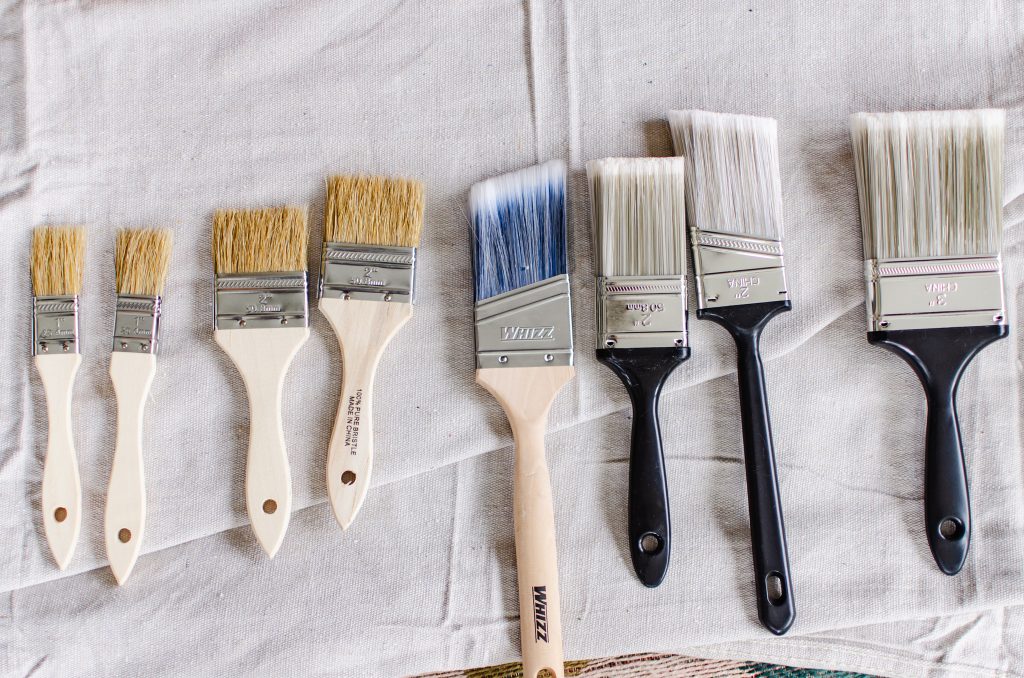 Various sizes of paint brushes for painting terracotta pots.