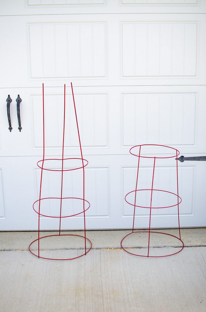 tomato cages for diy plant stand on ground in front of garage door