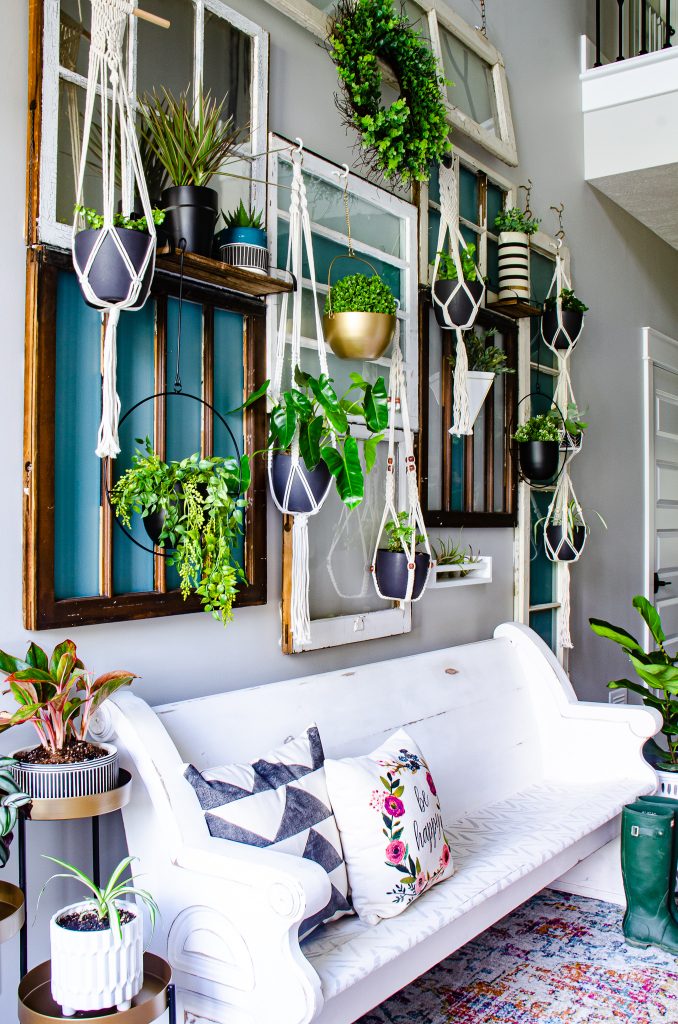 Hanging plant wall in two story entry