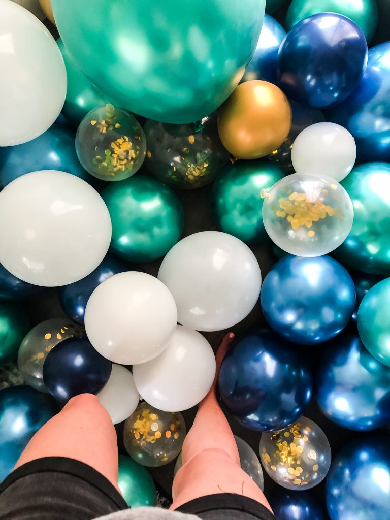 Green, blue, white and gold balloons