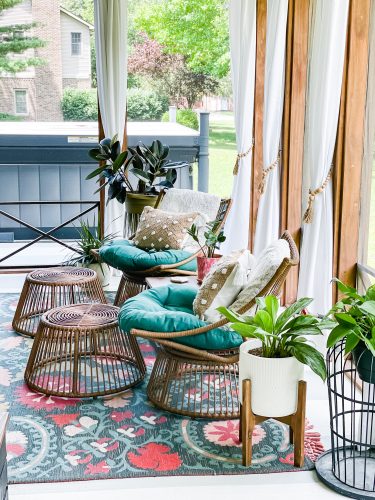 Back Porch Refresh with white hanging curtains, wicker furniture and outdoor plants, modern boho design | The Weekender on HauteHouseLove.com