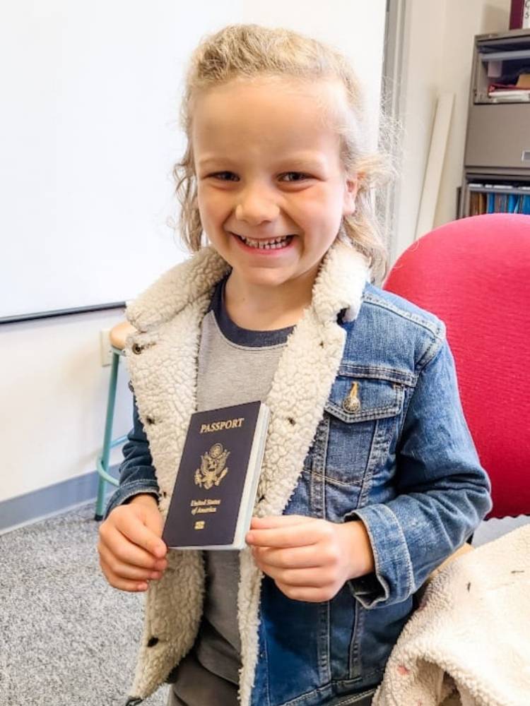 Little boy holding a passport
