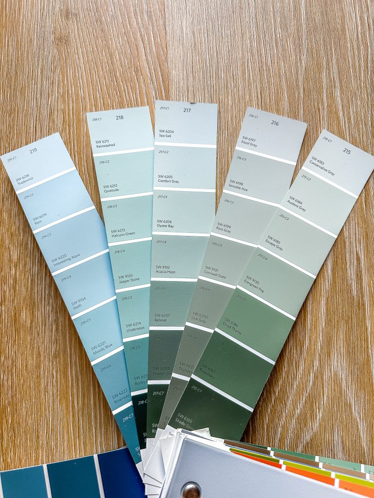 Sherwin Williams paint fan with a few swatches pulled out.