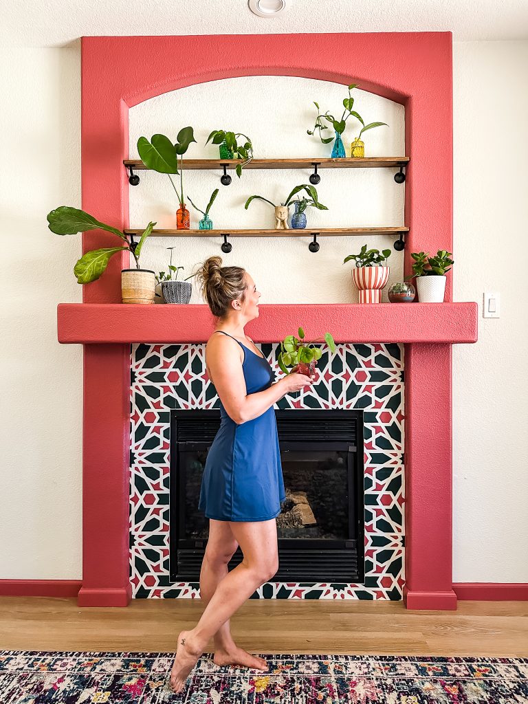 DIY Plant Shelves over a painted fireplace with Matte Black Hardware