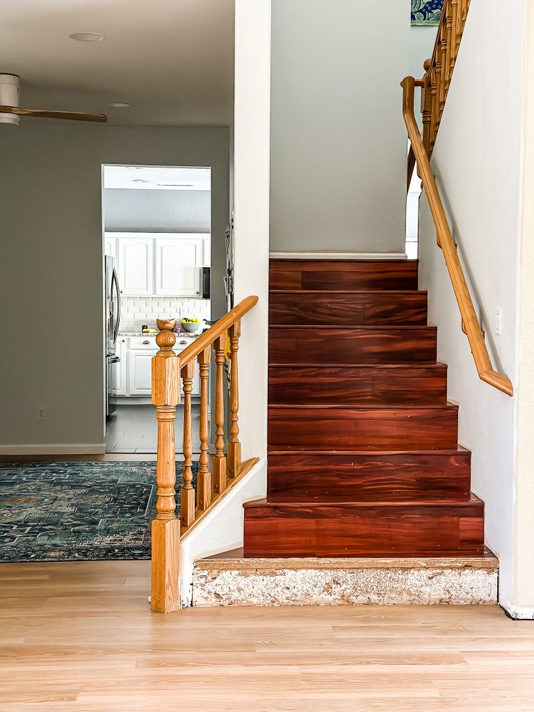Dated Staircase with cherry laminate  floors